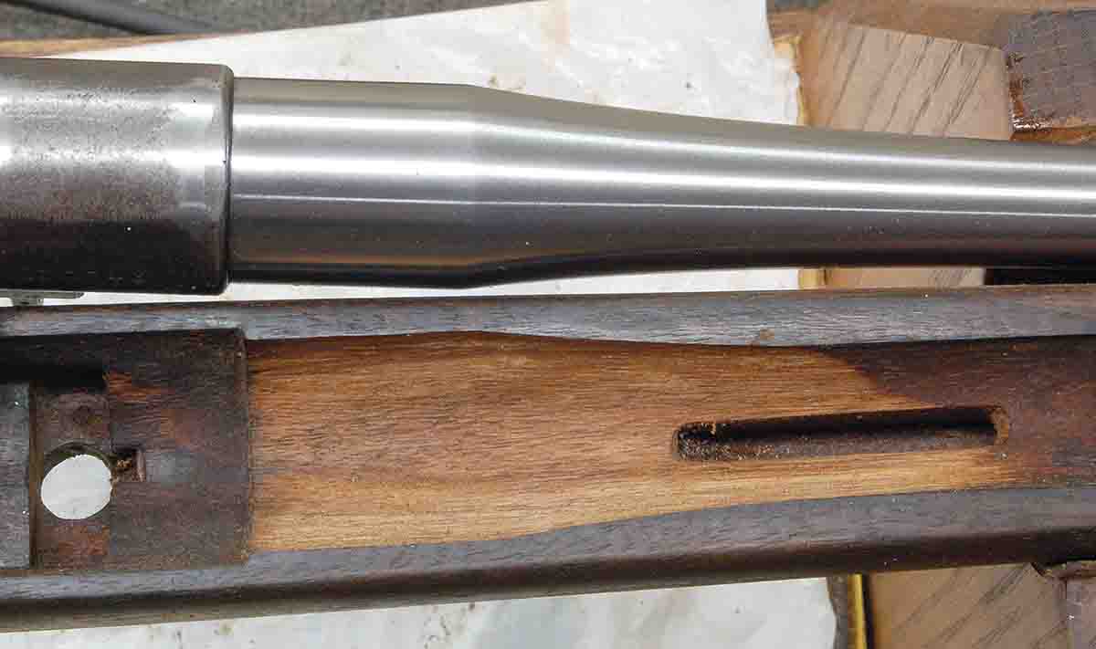 To fit the new barrel into the military stock, the barrel channel must be relieved just ahead of the receiver.